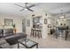 Inviting living space with tile flooring, modern ceiling fan and comfortable gray sectional sofa at 735 E Cochise Dr, Phoenix, AZ 85020