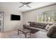 Spacious living room featuring a comfortable sofa and natural light at 735 E Cochise Dr, Phoenix, AZ 85020