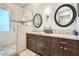 Elegant bathroom with dual vanities, granite counters, and a tiled shower at 7400 E Gainey Club Dr # 206, Scottsdale, AZ 85258