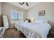 Bright bedroom with two beds, shutters, and a large mirror at 7400 E Gainey Club Dr # 206, Scottsdale, AZ 85258