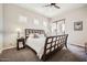 Inviting bedroom featuring a queen bed, ceiling fan, and balcony access at 7400 E Gainey Club Dr # 206, Scottsdale, AZ 85258