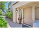 Inviting front entryway featuring a decorative cactus sculpture and stylish door at 7400 E Gainey Club Dr # 206, Scottsdale, AZ 85258