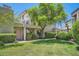 Attractive home exterior with green lawn and mature landscaping at 7400 E Gainey Club Dr # 206, Scottsdale, AZ 85258