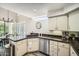 Kitchen with granite counters, stainless steel appliances, modern fixtures, and eat-in dining at 7400 E Gainey Club Dr # 206, Scottsdale, AZ 85258