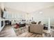 Spacious living room features high ceilings, shutters, and wood floors at 7400 E Gainey Club Dr # 206, Scottsdale, AZ 85258
