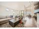 Open concept living room with dining room, vaulted ceilings, and modern fixtures at 7400 E Gainey Club Dr # 206, Scottsdale, AZ 85258