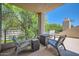 Relaxing patio featuring stylish seating with green views and blue skies at 7400 E Gainey Club Dr # 206, Scottsdale, AZ 85258