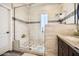 Luxurious walk-in shower featuring stone accents and a built-in bench at 7400 E Gainey Club Dr # 206, Scottsdale, AZ 85258