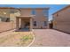 The exterior backyard showcases a covered patio, gravel, and a block fence at 9534 N 82Nd Ln, Peoria, AZ 85345