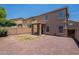 Backyard features a covered patio and gravel, with a block wall for privacy at 9534 N 82Nd Ln, Peoria, AZ 85345