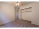 Neutral bedroom features a ceiling fan, carpet, and closet for ample storage at 9534 N 82Nd Ln, Peoria, AZ 85345
