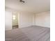 Spacious bedroom with neutral carpet, white walls, and ample closet space at 9534 N 82Nd Ln, Peoria, AZ 85345