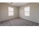 Bedroom with carpet, natural lighting from two windows at 9534 N 82Nd Ln, Peoria, AZ 85345