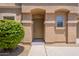 Inviting front door with desert landscaping and a covered entryway for a charming touch at 9534 N 82Nd Ln, Peoria, AZ 85345
