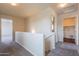 Bright hallway features neutral-toned carpet and white walls and trim at 9534 N 82Nd Ln, Peoria, AZ 85345