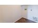 A clean, minimalist laundry room with wood-look floors and washer/dryer hookups at 9534 N 82Nd Ln, Peoria, AZ 85345