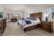 Primary bedroom suite with a large bed, mountain views, and a sitting area at 9802 E Hidden Valley Rd, Scottsdale, AZ 85262