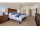 Spacious bedroom suite with a large bed, and access to the en-suite bathroom at 9802 E Hidden Valley Rd, Scottsdale, AZ 85262