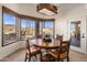 Dining area boasts mountain views, decorative chandelier, and natural light at 9802 E Hidden Valley Rd, Scottsdale, AZ 85262