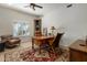 Cozy home office with desk, chair, and plenty of natural light at 9802 E Hidden Valley Rd, Scottsdale, AZ 85262