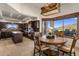 Eat-in kitchen showcasing granite countertops, an island, stainless appliances, and natural light at 9802 E Hidden Valley Rd, Scottsdale, AZ 85262