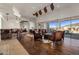 Spacious living room boasts hardwood floors, high ceilings, and large windows with scenic views at 9802 E Hidden Valley Rd, Scottsdale, AZ 85262