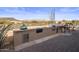 Outdoor kitchen featuring brick counters with a gas grill and desert views at 9802 E Hidden Valley Rd, Scottsdale, AZ 85262