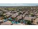 This aerial view showcases multiple backyard swimming pools, lush lawns, and neighborhood charm at 10413 E Emelita Ave, Mesa, AZ 85208