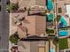 Aerial view of a single-Gathering home with backyard pool, pergola, and desert landscaping at 10413 E Emelita Ave, Mesa, AZ 85208