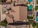 Aerial view of a home featuring a swimming pool, pergola, and an artificial grass area at 10413 E Emelita Ave, Mesa, AZ 85208