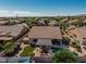 This backyard features a well-maintained pool, covered patio, and artificial grass at 10413 E Emelita Ave, Mesa, AZ 85208