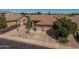 Beautiful home with a three-car garage, desert landscaping, and a well-maintained front yard at 10413 E Emelita Ave, Mesa, AZ 85208