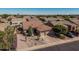 Lovely home with three-car garage, desert-style landscaping, and scenic neighborhood views at 10413 E Emelita Ave, Mesa, AZ 85208