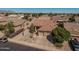 Attractive home with three-car garage, desert-style front yard and mature trees at 10413 E Emelita Ave, Mesa, AZ 85208