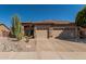 Charming single-story home featuring a well-kept landscape and three-car garage at 10413 E Emelita Ave, Mesa, AZ 85208