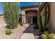 Close up front entry with desert landscaping and decorative stone accents at 10413 E Emelita Ave, Mesa, AZ 85208
