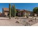 Well-maintained home featuring low-maintenance desert landscaping in front yard at 10413 E Emelita Ave, Mesa, AZ 85208