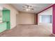 Open living room concept with multiple entryways and neutral carpet at 10621 W Oakmont Dr, Sun City, AZ 85351