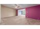 Bright living room featuring tan brick wall, neutral carpet, and an open layout at 10621 W Oakmont Dr, Sun City, AZ 85351