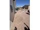 Low maintenance backyard with gravel and stepping stones throughout the area at 11596 W Sierra Dawn Blvd # 247, Surprise, AZ 85378
