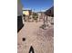 Gravel yard with fenced garden and connections for sprinklers at 11596 W Sierra Dawn Blvd # 247, Surprise, AZ 85378