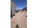 Low maintenance backyard with gravel and stepping stones throughout the area at 11596 W Sierra Dawn Blvd # 247, Surprise, AZ 85378