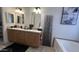 Dual sink bathroom with a spacious vanity, large mirrors, and soft lighting for a luxurious feel at 11596 W Sierra Dawn Blvd # 247, Surprise, AZ 85378