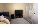 Neutral bedroom featuring a TV, closet, and soft colors for a peaceful space at 11596 W Sierra Dawn Blvd # 247, Surprise, AZ 85378