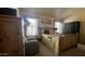 Warm bedroom with a cozy chair, natural light from windows, and lovely decor at 11596 W Sierra Dawn Blvd # 247, Surprise, AZ 85378