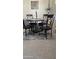 Stylish dining room with seating for four features updated lighting and neutral decor at 11596 W Sierra Dawn Blvd # 247, Surprise, AZ 85378