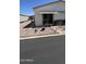 Manicured front yard with seating, desert plants, and easy-care rock landscaping at 11596 W Sierra Dawn Blvd # 247, Surprise, AZ 85378