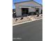 Manicured front yard with seating, desert plants, and easy-care rock landscaping at 11596 W Sierra Dawn Blvd # 247, Surprise, AZ 85378