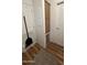 Functional hallway features a built-in linen closet, and modern vinyl floors at 11596 W Sierra Dawn Blvd # 247, Surprise, AZ 85378