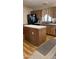 Eat-in kitchen features an island, wood cabinetry, modern appliances, and ample counter space at 11596 W Sierra Dawn Blvd # 247, Surprise, AZ 85378